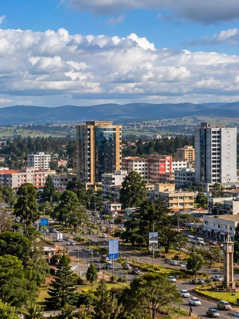 Eldoret from above: the clock tower, green avenues and towers below the hills